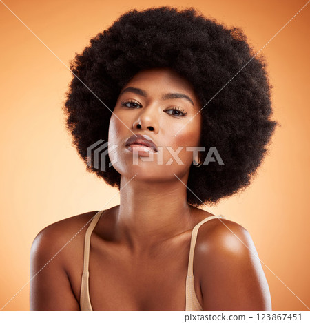 Skincare, portrait and black woman with face makeup against an orange studio background. Young, african and beauty girl model with glow from cosmetics, healthy body and care for skin with dermatology 123867451