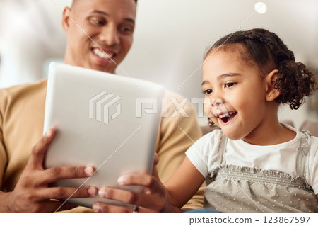 Happy family, digital tablet and girl bonding with father in a living room, happy, gaming and playing online together. Black family, children and happy parent showing child a learning internet app 123867597
