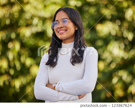 Thinking, smile and woman with vision in nature during travel, freedom and holiday in New Zealand. Young, happy and girl with idea, arms crossed and pride in a park or garden to relax on vacation Thinking, smile and woman with vision in nature during travel, freedom and holiday in New Zealand. Young, happy and girl with idea, arms crossed and pride in a park or garden to relax on vacation 123867624