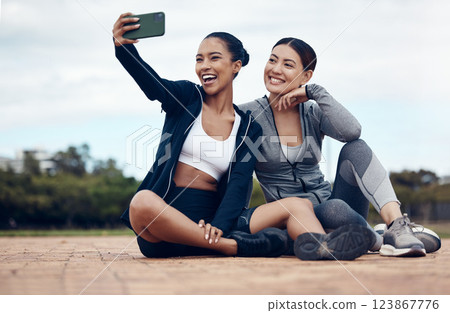 Selfie, women and friends outdoor for training, exercise and fitness for health, workout and wellness. Female trainers, healthy girls or with smartphone outside warm up, smile or relax in sportswear 123867776
