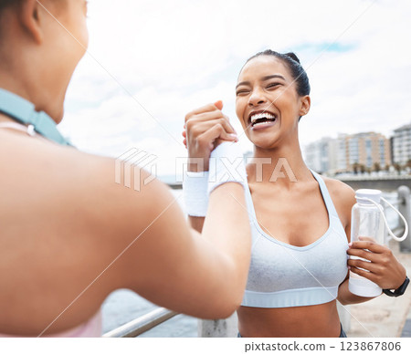 Handshake, women and fitness training winner achievement for running competition in city street. Happy girls, smiling and support after successful sports goal wellness workout together outdoors Handshake, women and fitness training winner achievement for running competition in city street. Happy girls, smiling and support after successful sports goal wellness workout together outdoors 123867806