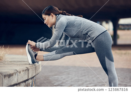 Stretching, fitness and runner woman outdoor city for wellness exercise, running or training in sports shoes. Young athlete person doing workout for healthy body or muscle legs on an urban sidewalk Stretching, fitness and runner woman outdoor city for wellness exercise, running or training in sports shoes. Young athlete person doing workout for healthy body or muscle legs on an urban sidewalk 123867816