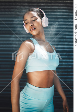 Fitness, headphones or black woman listening to music for workout motivation, wellness or stress relief. Young gen z girl streaming radio song or audio podcast for sports exercise, cardio or training Fitness, headphones or black woman listening to music for workout motivation, wellness or stress relief. Young gen z girl streaming radio song or audio podcast for sports exercise, cardio or training 123867902