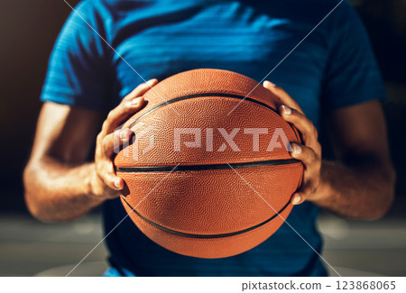Hands, basketball and sports man ready for outdoor match game training with athletic grip closeup. Fitness, exercise and athlete male holding ball prepared to practice for competition macro. Hands, basketball and sports man ready for outdoor match game training with athletic grip closeup. Fitness, exercise and athlete male holding ball prepared to practice for competition macro. 123868065