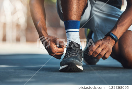 Fitness, hands or black man tie shoes lace before start of running exercise, fitness training or sports workout. Health, wellness and legs of marathon runner, athlete or person prepare for cardio run Fitness, hands or black man tie shoes lace before start of running exercise, fitness training or sports workout. Health, wellness and legs of marathon runner, athlete or person prepare for cardio run 123868095
