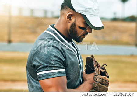 Man, baseball and glove with focus, game and determination as fielder, pitcher or baseball player. Athlete, sport and training for wellness, fitness and health in competition, sports or match outdoor 123868107