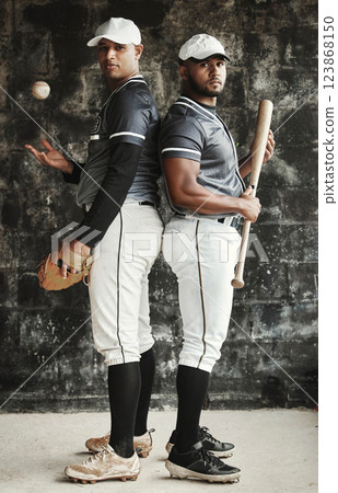 Baseball, sports and team with a man athlete and player standing back to back in uniform for training. Sport, teamwork and uniform with a portrait of friends ready for a game on a wall background 123868150