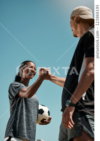Handshake, soccer and team motivation, game goal and competition celebrate with blue sky mock up for marketing or advertising. Inclusion, support and solidarity sign of football fitness people mockup 123868195