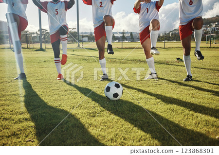 Football, soccer field and team stretching legs preparing for match, practice or game. Ball, sports and group of men outdoors on pitch getting ready for training, exercise or fitness workout outside. 123868301