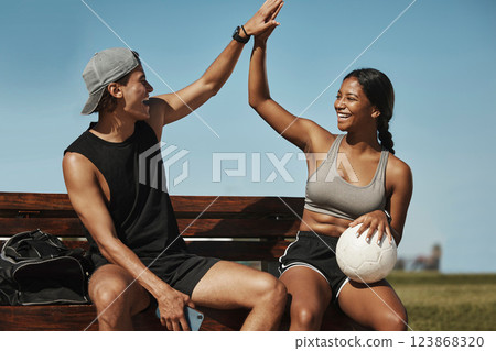 High five, soccer and team celebrate winning match, happy and smile on bench with ball together. Football, players and victory enjoy game win, practice and exercise for wellness, training and workout 123868320
