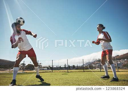 Sports, summer and soccer ball on head on field during game or training exercise. Health, fitness and ball header, teamwork at football competition and players on grass together for performance match 123868324