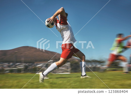 Training, man and soccer ball throw on soccer field during game or competition outdoor. Sports, fitness and football player pitching ball during practice, exercise or workout session on grass field 123868404
