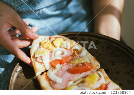 Sliced and served hawaiian mini pizza Sliced and served hawaiian mini pizza 123868564