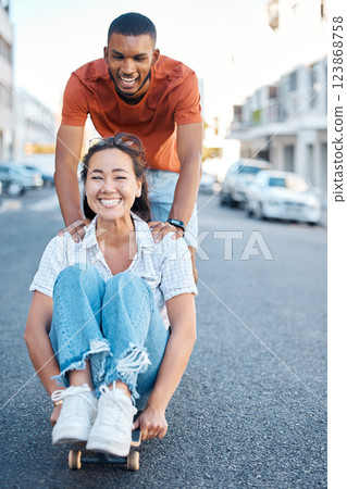 Skateboard, young couple and fun, street style and playful sport date in urban cityscape. Gen Z fashion, man and woman happy, skateboarding and diversity, together and bonding outdoors in the city. 123868758