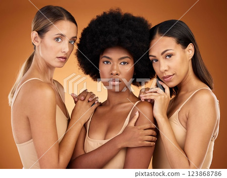 Diversity, women and cosmetics with natural beauty, proud and confident with brown studio background together. Portrait, makeup and girls being relax, sisterhood and magazine cover for skincare. 123868786