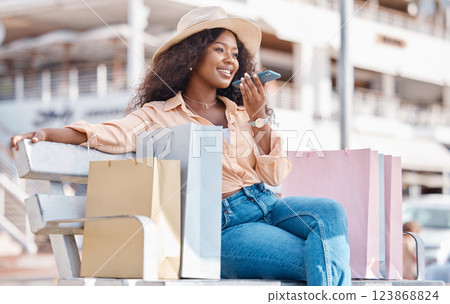 Shopping, fashion and phone call, a black woman with a smile resting outside a mall. Relax on bench, happy customer after discount sale at shopping mall or designer boutique and talking on smartphone Shopping, fashion and phone call, a black woman with a smile resting outside a mall. Relax on bench, happy customer after discount sale at shopping mall or designer boutique and talking on smartphone 123868824