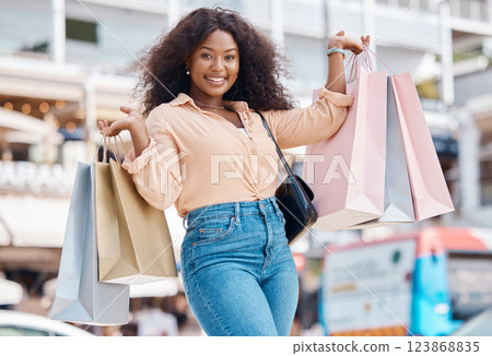 Excited black woman portrait, shopping bag and city consumer smile for happy sales, luxury fashion product and market choice from San Francisco mall stores. Wealthy young customer on holiday travel 123868835