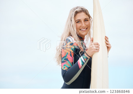 Surfing, beach and surfer woman at beach to surf, travel and body boarding adventure on holiday while happy on summer trip. Portrait of a female with surfboard and smile on Australia mockup holiday 123868846