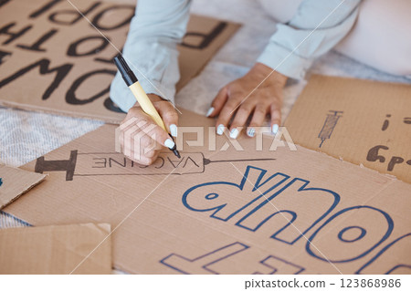 Covid, poster and protest sign woman prepare, create and use carboard for vaccine, corona safety and protection. Female, write and demonstrators against vaccinations, make placard and slogan. 123868986