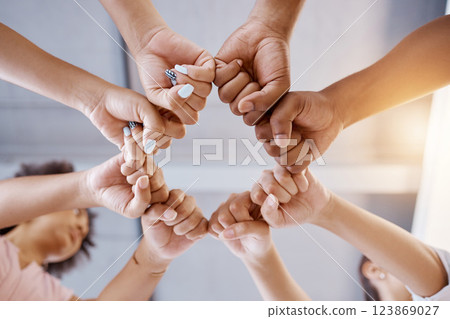 Fist bump, team building and business people in a meeting with mission, our vision and growth mindset in a circle. Below, huddle and hands of employees with group goals, targets and global support Fist bump, team building and business people in a meeting with mission, our vision and growth mindset in a circle. Below, huddle and hands of employees with group goals, targets and global support 123869027