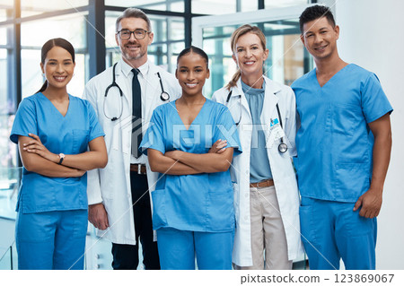 Happy doctors and nurse smile at a hospital with support, teamwork and collaboration with diversity. Team of expert medical professionals smiling at work together at clinic in the healthcare industry 123869067