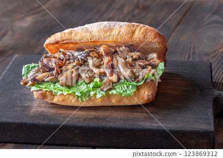 Delicious vegetarian sandwich with toasted ciabatta, fried oyster mushrooms, and yellow sauce Delicious vegetarian sandwich with toasted ciabatta, fried oyster mushrooms, and yellow sauce 123869312