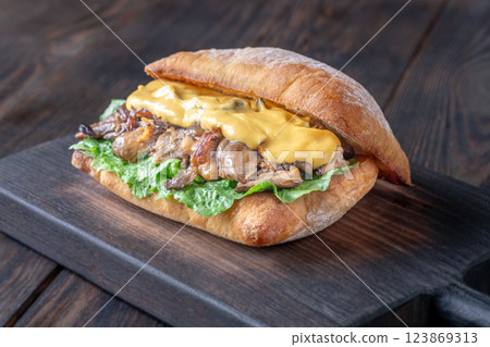 Delicious vegetarian sandwich with toasted ciabatta, fried oyster mushrooms, and yellow sauce Delicious vegetarian sandwich with toasted ciabatta, fried oyster mushrooms, and yellow sauce 123869313