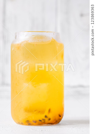 Waltzing Matilda cocktail with passion fruit, gin, and ginger ale in jar glass 123869363