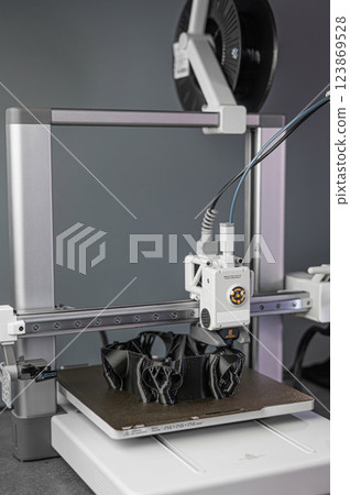 Modern 3D printer printing figure close-up 123869528