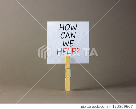 How can we help symbol. Concept words How can we help on beautiful white paper on clothespin. Beautiful grey background. Business and how can we help concept. Copy space. How can we help symbol. Concept words How can we help on beautiful white paper on clothespin. Beautiful grey background. Business and how can we help concept. Copy space. 123869667