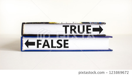 True or false symbol. Concept word True or False on beautiful books. Beautiful white table white background. Business and true or false concept. Copy space. 123869672