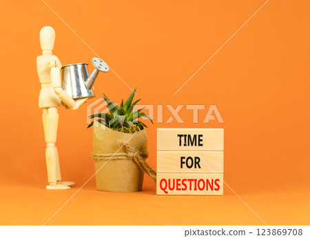 Time for questions symbol. Concept words Time for questions on beautiful wooden blocks. Beautiful orange background. Businessman model. Business time for questions concept. Copy space. 123869708