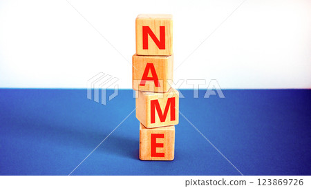 Name symbol. Concept word Name on beautiful wooden blocks. Beautiful white and blue background. Business, lifestyle, support and name concept. Copy space. Name symbol. Concept word Name on beautiful wooden blocks. Beautiful white and blue background. Business, lifestyle, support and name concept. Copy space. 123869726