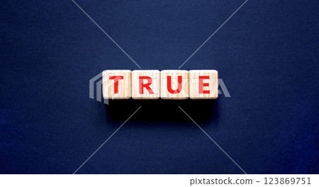 True symbol. Concept word True on beautiful wooden blocks. Beautiful black table black background. Business, lifestyle, support and true concept. Copy space. 123869751