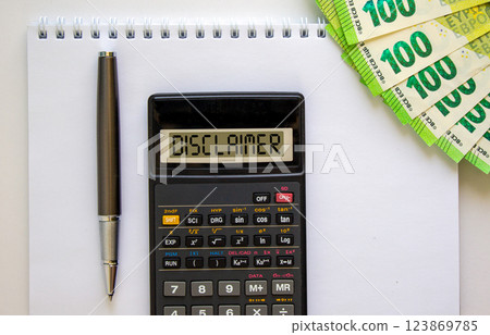 Disclaimer symbol. Concept word Disclaimer on beautiful black calculator. Beautiful white background. Euro bills. Black pen. Business disclaimer concept. Copy space. 123869785