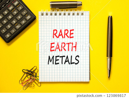 Rare earth metals symbol. Concept words Rare earth metals on beautiful white note. Black pen. Calculator. Beautiful yellow background. Business and rare earth metals concept. Copy space. Rare earth metals symbol. Concept words Rare earth metals on beautiful white note. Black pen. Calculator. Beautiful yellow background. Business and rare earth metals concept. Copy space. 123869817