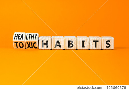 Healthy or toxic habits symbol. Concept words Healthy habits or Toxic habits on beautiful wooden blocks. Beautiful orange table orange background. Business healthy or toxic habits concept. Copy space. Healthy or toxic habits symbol. Concept words Healthy habits or Toxic habits on beautiful wooden blocks. Beautiful orange table orange background. Business healthy or toxic habits concept. Copy space. 123869876