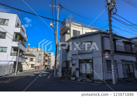 Traditional Japanese Shrine with Autumn Colors and Clear Blue Sky Dec 8 2024 123871886