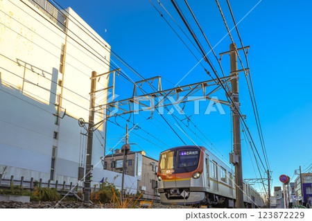 Dec 8 2024 Calm Urban Neighborhood Street Beneath Clear Blue Skies, Jiyugaoka 123872229