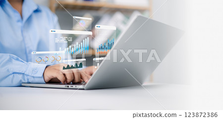 Business analytics with charts, Financial and marketing strategy, KPIs to improve organizational performance, Businessman use computers to analyze business and manage corporate data in office. Business analytics with charts, Financial and marketing strategy, KPIs to improve organizational performance, Businessman use computers to analyze business and manage corporate data in office. 123872386