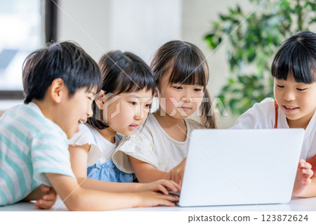 Children learning on a computer Children learning on a computer 123872624