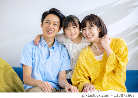 Young family, friendship, sofa, parents and children, smiling 123872662