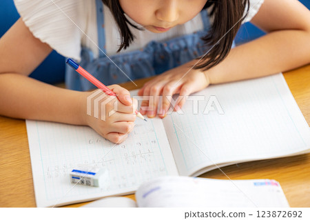 A girl studying in the living room 123872692