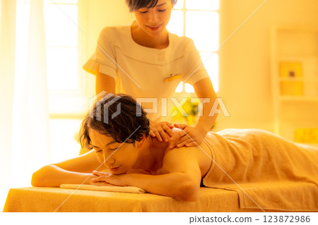 A young man receiving a massage at a beauty salon 123872986