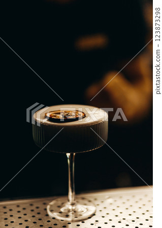 sweet and sour refreshing cocktail decorated with passion fruit on the bar counter sweet and sour refreshing cocktail decorated with passion fruit on the bar counter 123873298