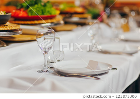 Menu mockup on wedding dinner. Birthday table setting. Overhead view. 123873300