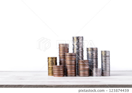 coins stacked on wooden with black background. Concept of saving money, economy, investment, growing business and wealth. 123874439