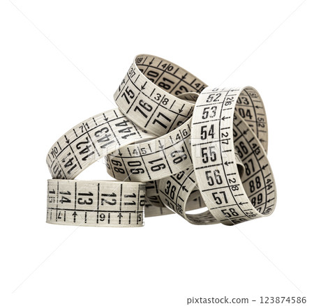 Close up of a coiled measuring tape, displaying various numerical measurements against a transparent background Close up of a coiled measuring tape, displaying various numerical measurements against a transparent background 123874586
