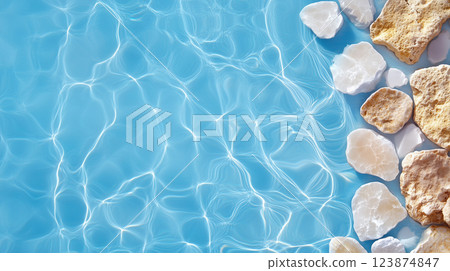 Beautiful Arrangement of Pebbles and Light on Water Surface 123874847