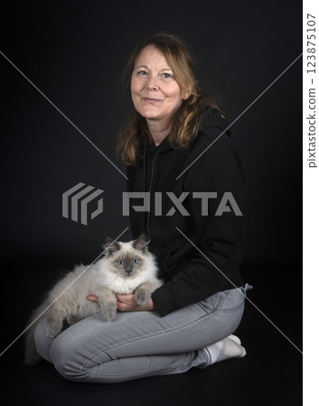 siberian cat and woman in studio 123875107